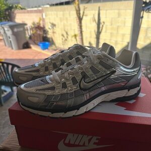Sz 10.5 Men, 12 Wmn Nike P-6000 Metallic Silver CN0149-001 Running Shoes Unisex